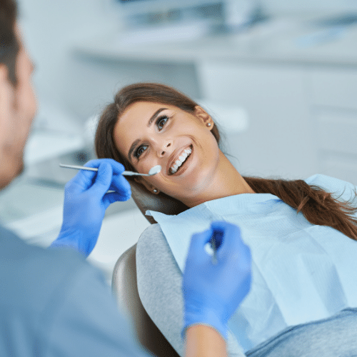 Patient receiving professional dental cleanings from a hygienist in a modern clinic, emphasizing preventive oral care and hygiene.